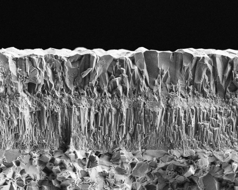 A SEM (Scanning Electron Microscope) image of a cross-section of the substrate and CVD coating of the MK1501