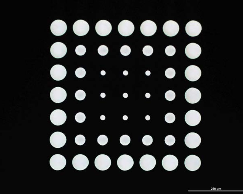 Inverse taper holes on exit