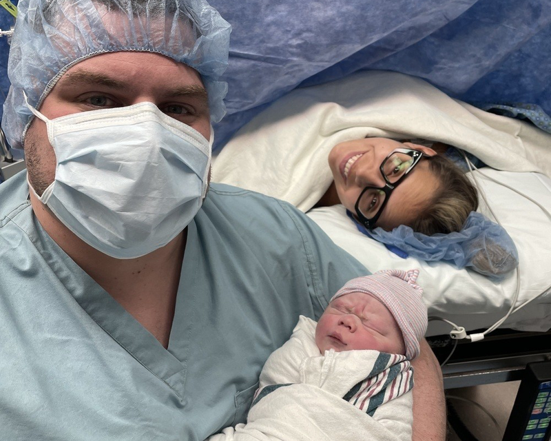 Brandon with his wife and newborn son, Maverick