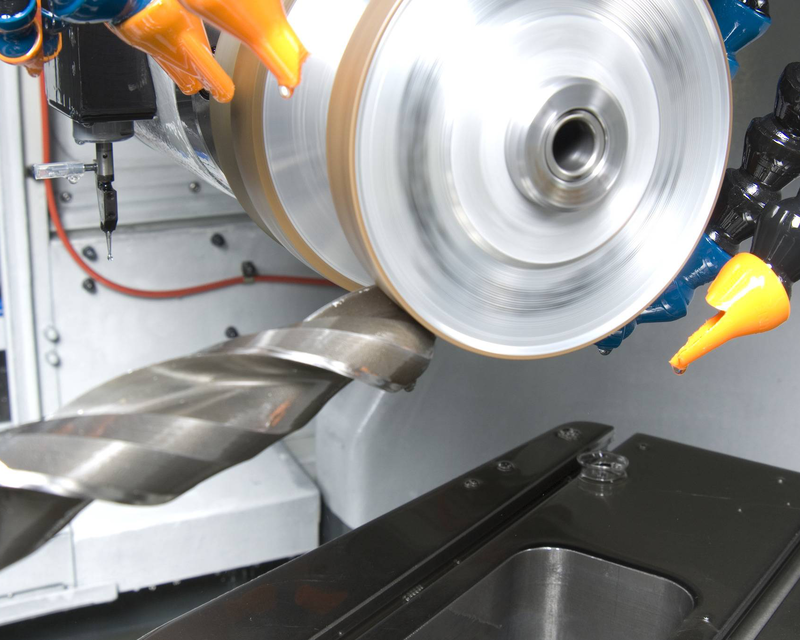 A solid end mill going through the reconditioning process